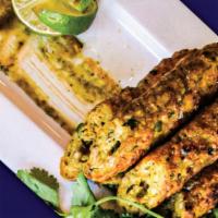 Chicken Seekh Kebab · Skewered & Layered Chicken, Flavored with Aromatic Spices & Herbs with Creamy Stuffing.