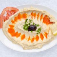 Hummus · Chickpeas blended with tahini, garlic, lemon juice, and olive oil.