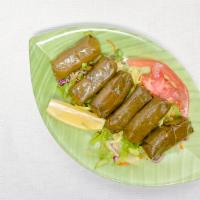 Stuffed Grape Leaves · Grape leaves stuffed with rice, herbs, spices, parsley, and onion.