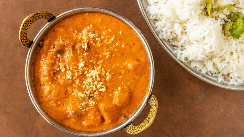 Navratan Korma · Vegetables braised with cream, and spices to produce a thick sauce. Served with a side of rice.
