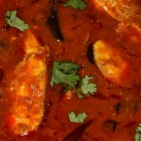 Fish Curry · Fish cooked with spicy, and sour curry. Served with a side of rice.