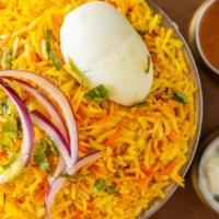 Chicken Biryani · Aromatic basmati rice, cooked in simmer with chicken with bones, and spices.