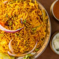 Veggie Biryani · Vegetables, cooked together in simmer with basmati rice, and spices.