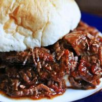 Chopped Beef Sandwich Plate · includes Baked Beans and Potato Salad and drink.