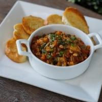 Caponata Siciliana · Sauteed eggplant, olives, capers served with house grilled toast