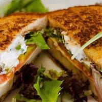 Cajun Turkey Melt · Organic lettuce, Pepper Jack cheese, grilled onions, organic tomatoes, pickles, toasted hone...