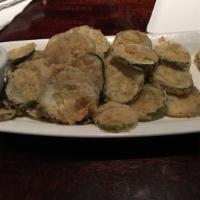 Fried Pickles · Thinly sliced pickles, buttermilk marinated, spiced flour, side car of chipotle-ranch dressi...