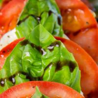 Caprese Salad · Fresh water Mozzarella, vine ripe tomatoes and basil leaves, served with EVOO and balsamic g...