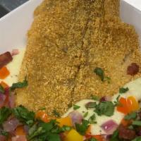 Catfish & Grits · Fried catfish filet over a creamy bed of grits.