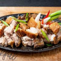 Lechon Kawali · Pork belly simmered in spices and deep fried until crispy.