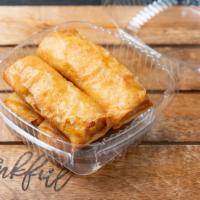 Turon (4) · Yellow plantain with yellow jackfruit bits, deep fried in a crispy egg roll wrapper.