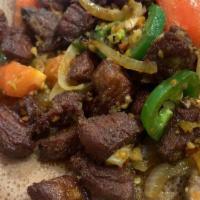 Keiy Wot · Fresh beef cooked with hot pepper sauce and Ethiopian spices.