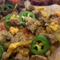 Yebeg Alecha · Lamb chunks sautéed with onion, green pepper and flavored with black pepper and Ethiopian bu...