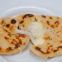 Pupusa · One corn meal, stuffed with your preference. Served with encurtido (cabbage relish) and salsa.