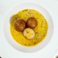 Gulab Jamun · Light cheese balls dipped in a cinnamon-flavored syrup.