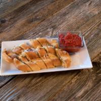 Crostino Bread · Delicious cheesy bread with fresh herb and butter seasonings.