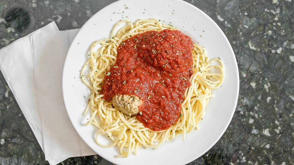 Spaghetti & Meatballs · Spaghetti served with two large meatballs covered with marinara sauce.
