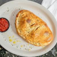 Classic Calzone · Pepperoni, canadian bacon, sausage and mozzarella cheese.