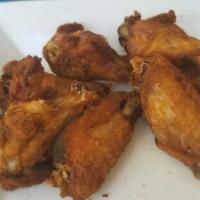 Buffalo Wings · Gluten free. Fried chicken wings tossed in your choice of buffalo, spicy ranch, Kentucky blu...