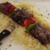 Grilled Filet Kabob · Gluten free. Cuts of filet mignon char-grilled with bell peppers and onions. Served over a b...