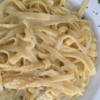 Fettuccine Alfredo · Tossed in our home-made alfredo sauce. Add toppings for an additional charge.