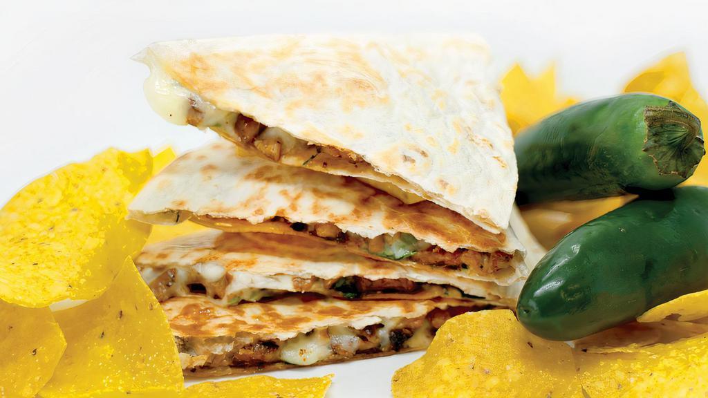 Quesadilla · Twelve inch tortilla filled with choice of protein, toppings, and sauce. Folded in half and grilled to perfection.