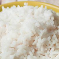 Side Of Coconut Rice · coconut flakes sauteed with coconut milk and infused in white rice