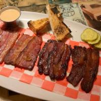 Bacon Flight Board · 8 slabs of chef's daily created hand cut bacon. Served with a warm buttermilk biscuit, house...