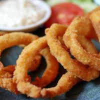 Onion Rings · Thick cut, battered onion rings fried until golden and crisp.