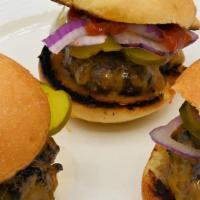 Ten-Sliders · Ten fresh natural angus chuck sliders on brioche buns with cheddar cheese, mayo, ketchup, re...