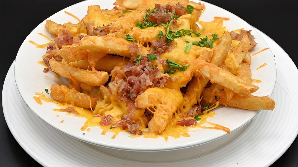 Cheese Fries · A generous portion of our coated fries topped with melted cheese and bacon, served with ranch