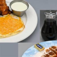 Waffle & Chicken · Belgian waffle, homemade chicken tenders and two cheddar fried eggs