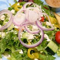 Greek Salad Large · Tomatoes and cucumbers served on a bed of lettuce topped with feta cheese, banana peppers, o...