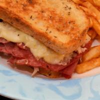 Reuben · Sliced corned beef, topped with sauerkraut, melted Swiss cheese and Thousand Island dressing...