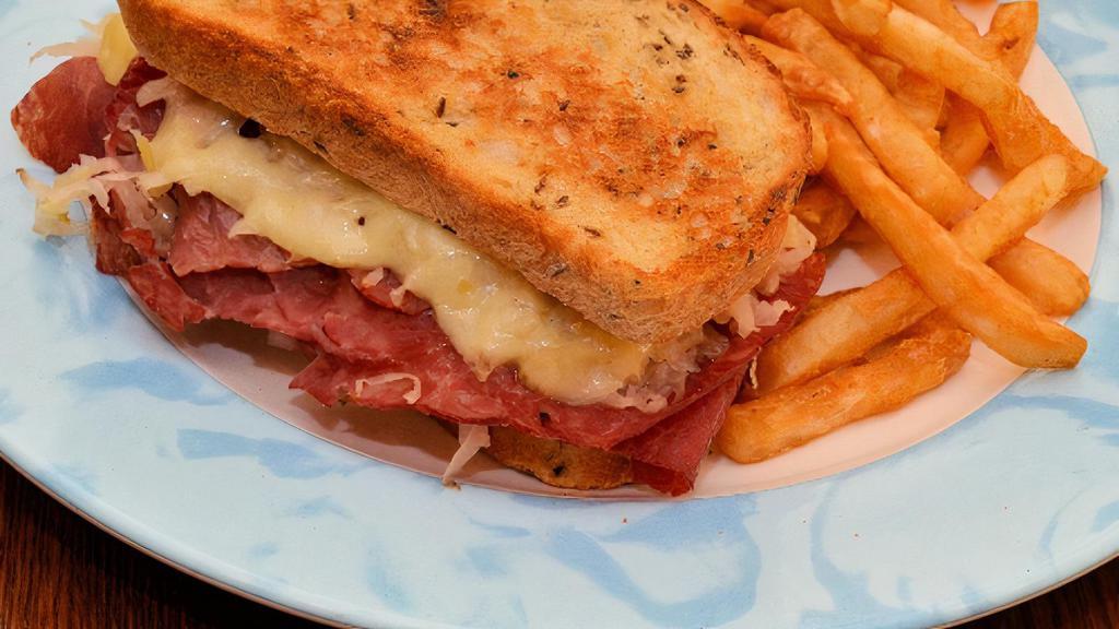 Reuben · Sliced corned beef, topped with sauerkraut, melted Swiss cheese and Thousand Island dressing on thick rye bread
