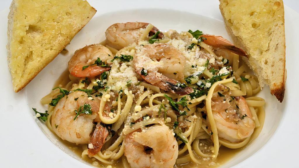 Shrimp Scampi · Extra large shrimp sautéed with fresh garlic and white wine over linguini