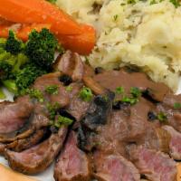 London Broil · Our Specialty. Marinated flank steak grilled to order and covered in our cabernet mushroom g...