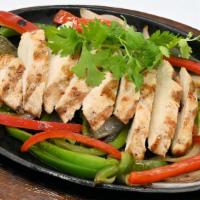 Fajita Chicken · Our classic fajitas served on a sizzling hot skillet with grilled onions and peppers, sour c...