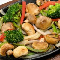 Vegetarian Fajita · Our classic fajitas served on a sizzling hot skillet with grilled onions and peppers, sour c...