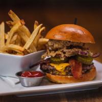 Smoky Bacon Burger Stack · two 100% grass-fed black angus beef patties, maple cayenne bacon, fried onion rings, smoky a...