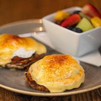 Gluten-Free Classic Benedict · canadian bacon, poached eggs, hollandaise and paprika on a multigrain gluten-free english mu...