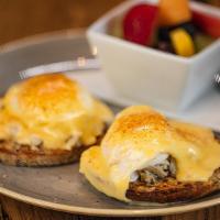 Gluten-Free Baltimore Benedict · lump crab meat, poached eggs and hollandaise on a multigrain gluten-free english muffin, dus...
