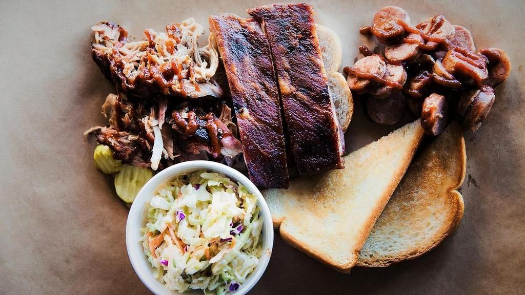 The Hogamaniac · Two ribs, pulled pork, and sausage. Served with one side and Texas Toast.