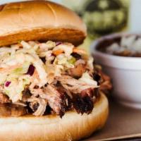 Carolina Pork Sandwich · Pulled pork tossed in bubba's sauce served on a toasted bun, topped with spicy Cole slaw.