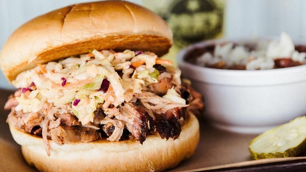 Carolina Pork Sandwich · Pulled pork tossed in bubba's sauce served on a toasted bun, topped with spicy Cole slaw.