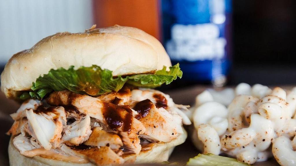 Pulled Chicken Breast Sandwich · Smoked chicken breast, BBQ mayo, BBQ sauce, lettuce & tomato jam served on a toasted Kaiser bun.