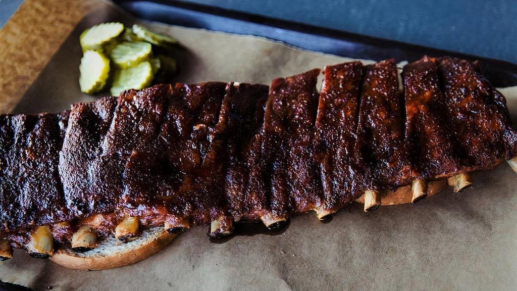 Full-Slab Of Ribs · Full slab of our pork spare ribs, serves 2-3 people. . **Minimum order of 2 Full Slabs for foil pan option.  All orders under 2 Full Slabs will automatically be wrapped in butcher paper.