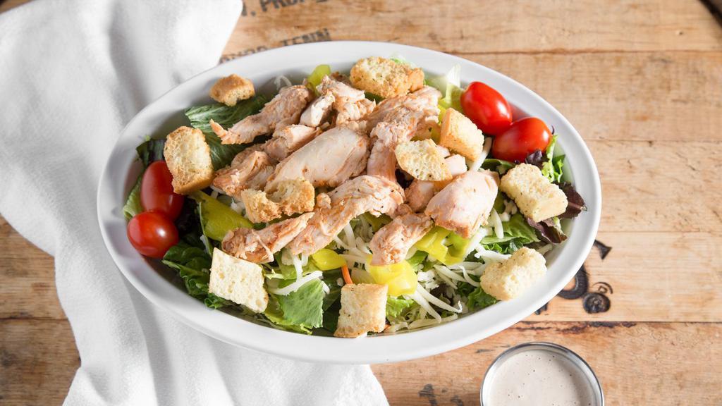 Smoked Chicken Salad · Mixed greens, pepperoncinis, cherry tomatoes, shredded provolone, and croutons. Topped with warm pulled chicken breast.