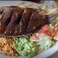 Fried Tilapia Fish · With rice, beans, salad.