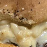 Mac Attack · Bun, beef patties, cheese, macaroni & cheese, cheese sauce